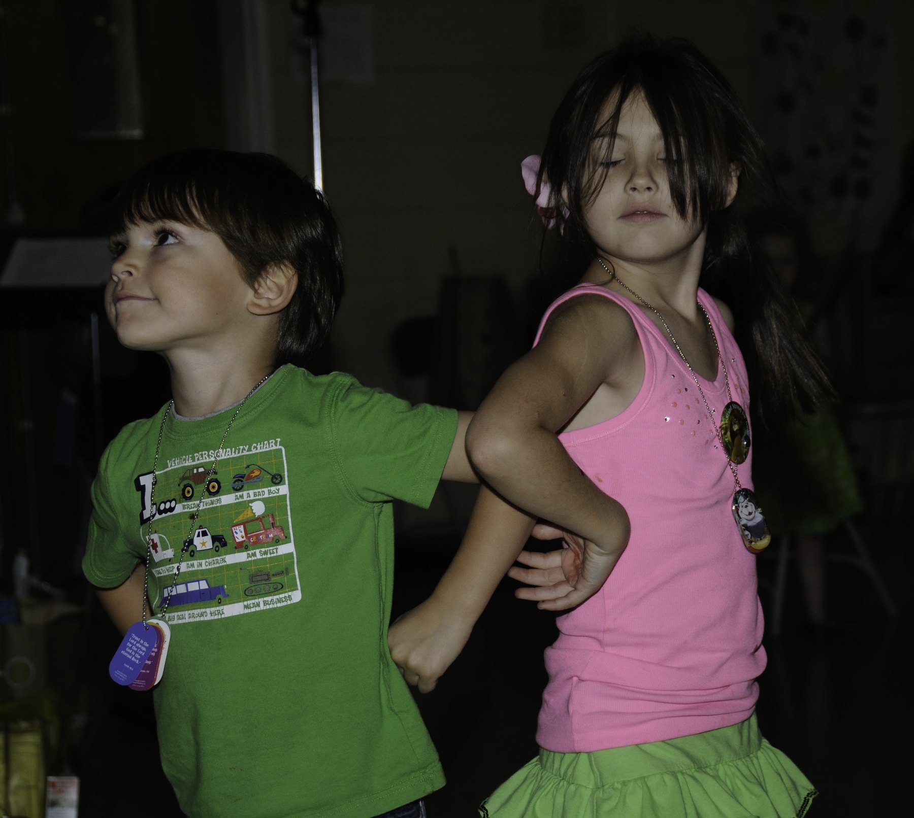 A young child playing outdoors during a church activity