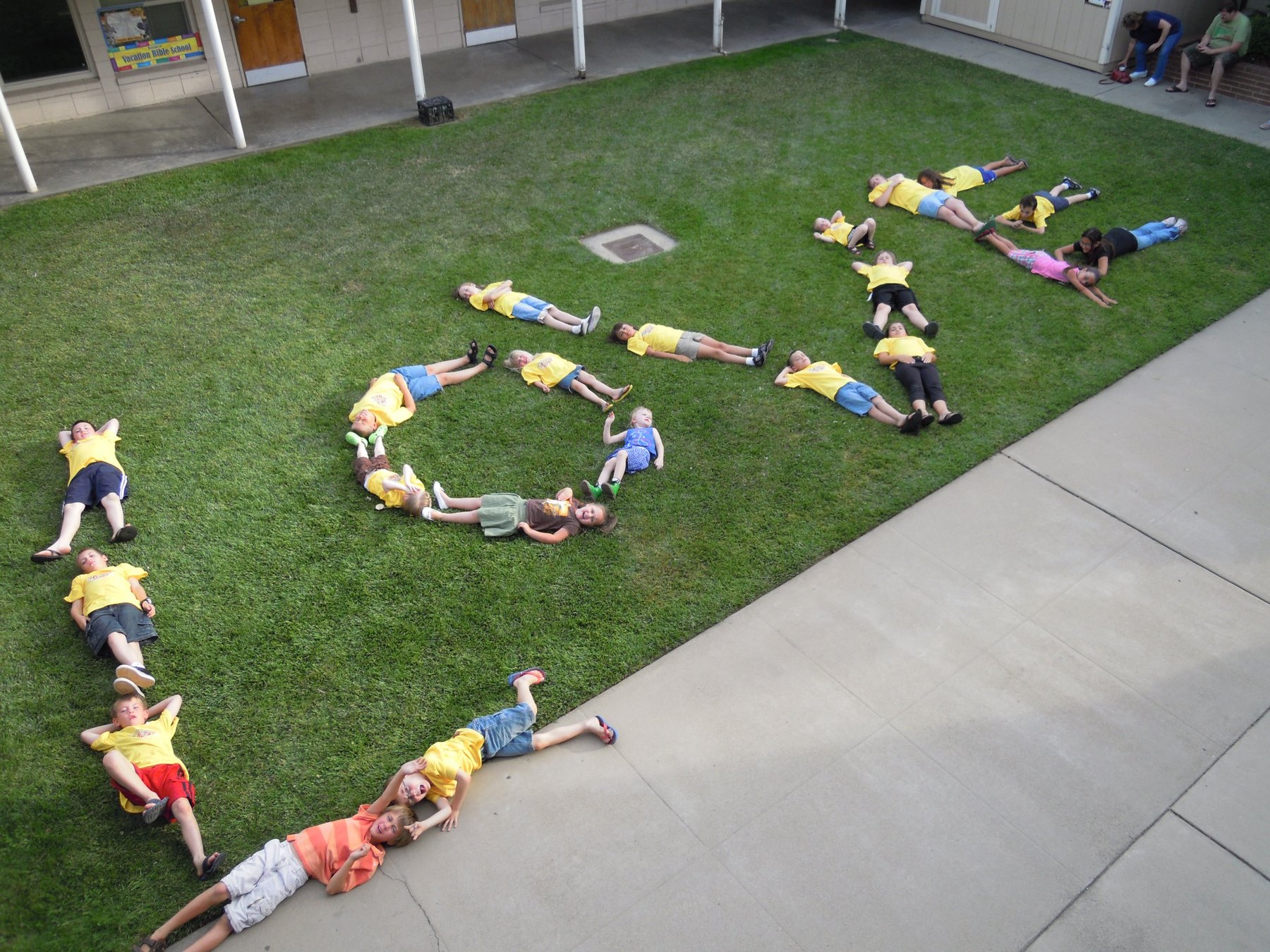 Children participating together in a Vacation Bible School outdoor activity