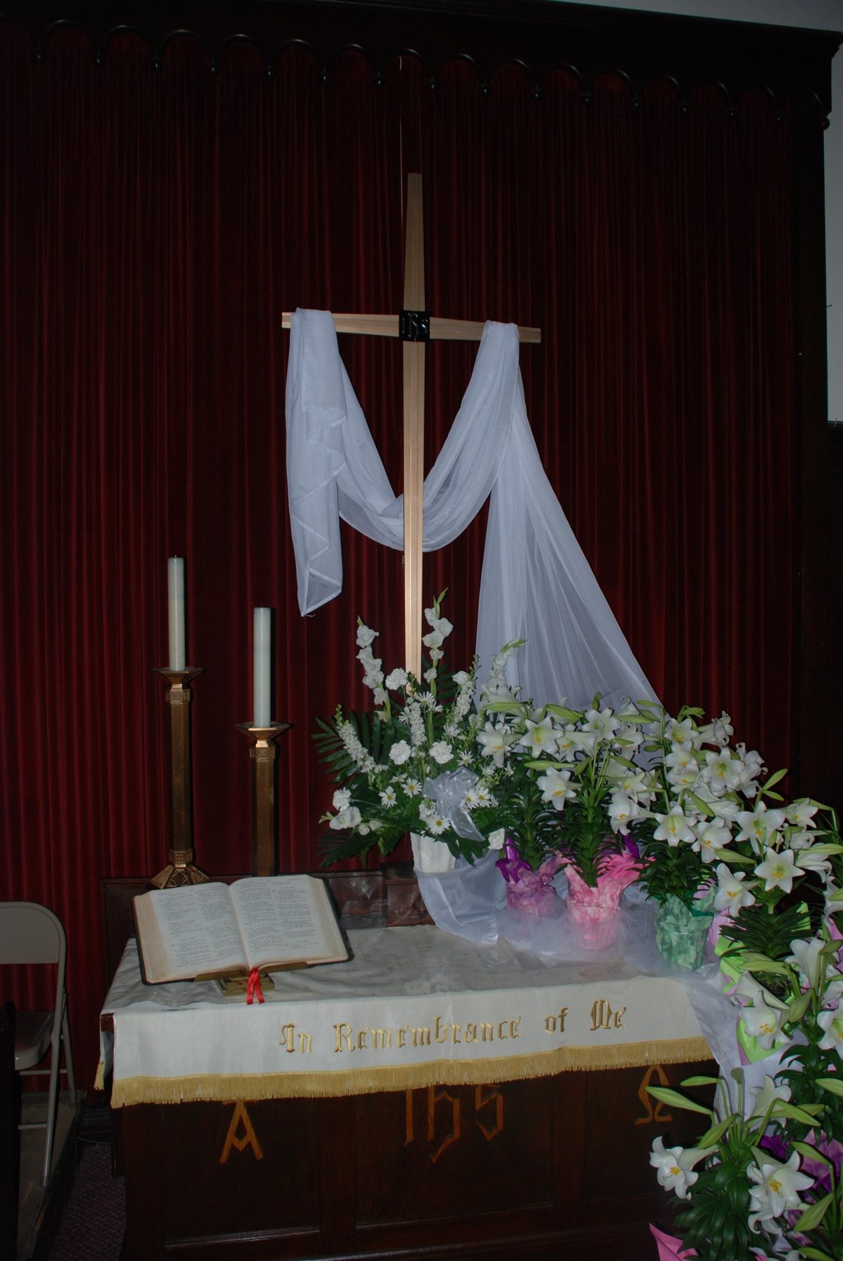 Easter lilies gathered around the altar.