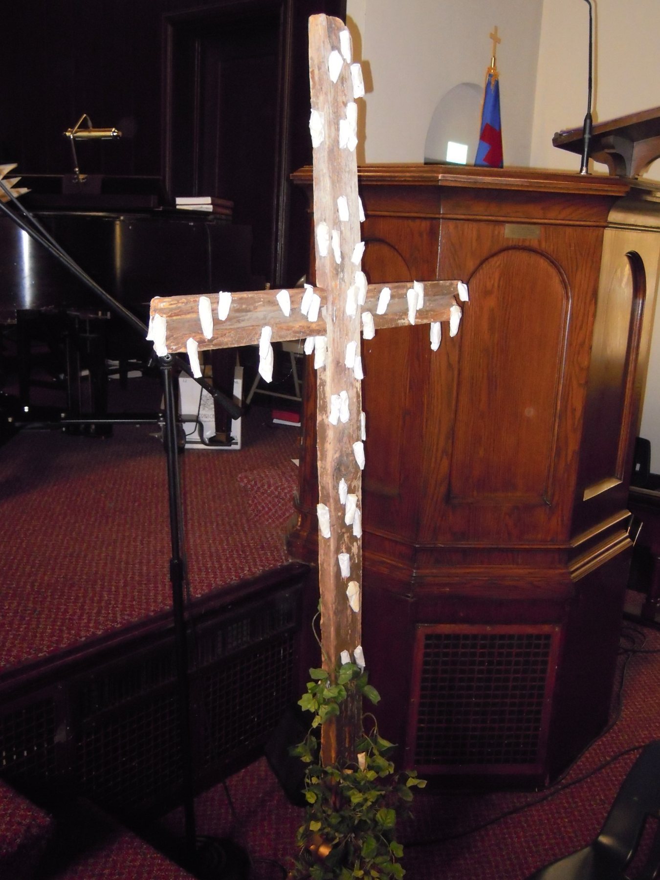 A rustic cross prepared for Palm Sunday and Holy Week.