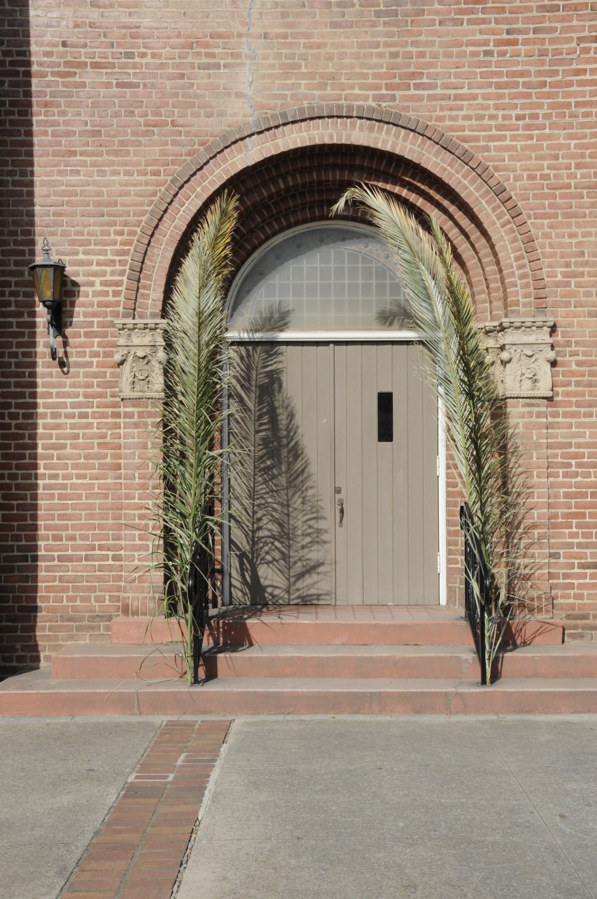 Palm branches frame one of the church entrances.